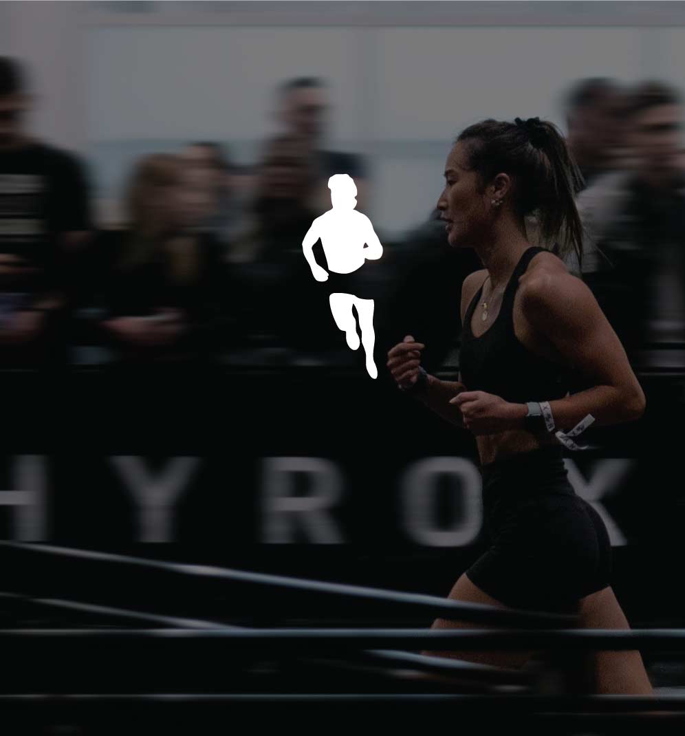 A woman running at HYROX